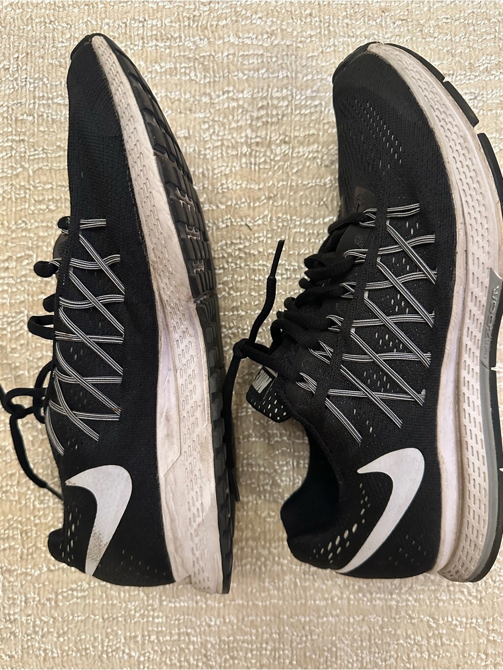 Nike Women’s Black Running Shoes with White Swoosh